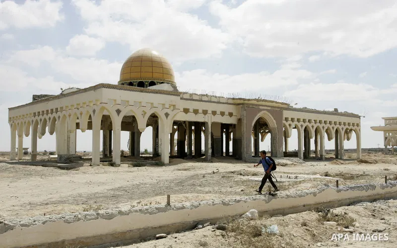 A Palestinian walks the rubble of the Gaza International Airport in Rafah in the southern Gaza Strip, on September 20, 2011. The 70-million-dollar airport which opened in November 1998 has been closed since February 2001...