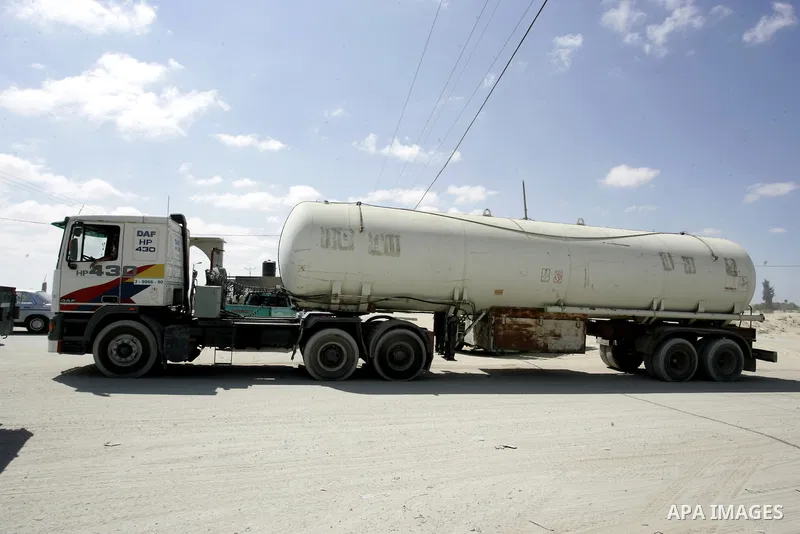 Trucks carrying goods and food supplies arrive in Rafah town in the southern Gaza Strip on September 20, 2011, after they crossed the Kerem Shalom terminal from Israel. The Palestinians are preparing to submit a formal r...