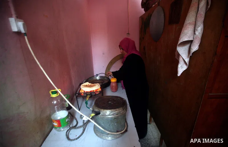 A Palestinian woman works at her house in the Jabaliya refugee camp in the northern area of the Gaza Strip on 20 September 2011. A diplomatic showdown looms at the United Nations this month when Palestinian President Mah...