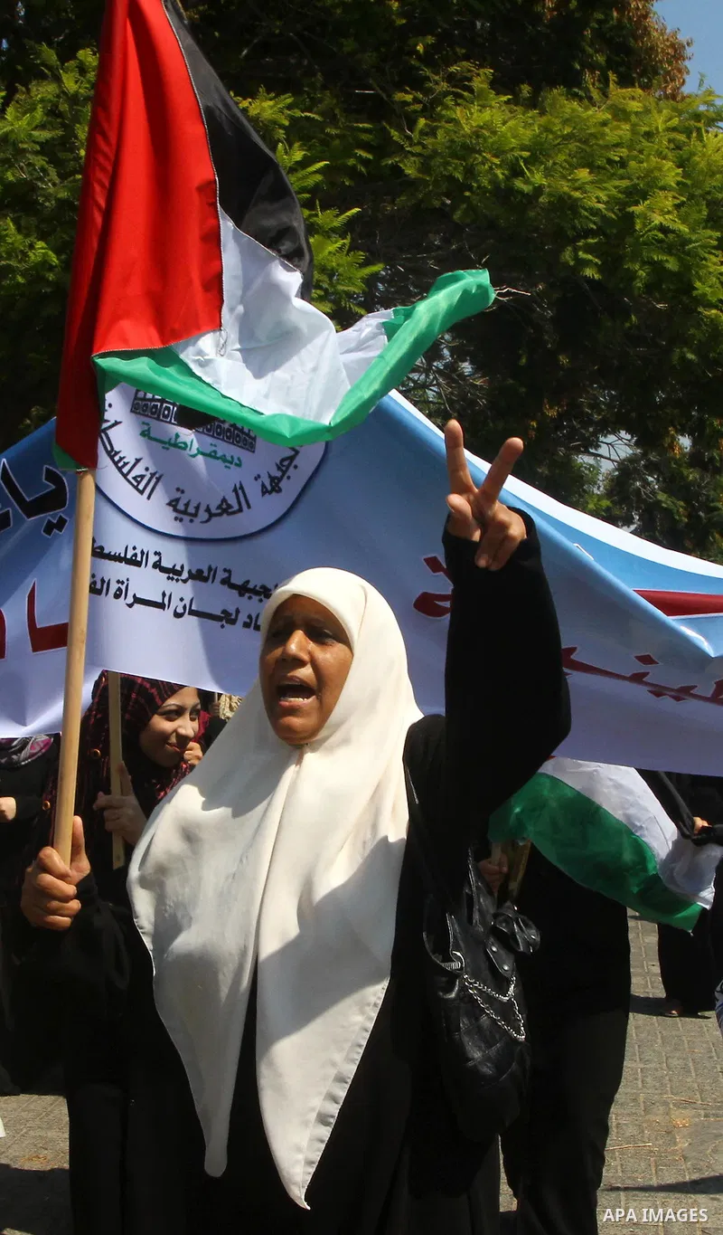 A Palestinian woman chants slogans during a demonstration in support of Palestinian leader Mahmud Abbas' bid for statehood recognition at the United Nations on September 21, 2011 in Gaza City. Palestinians are preparing...