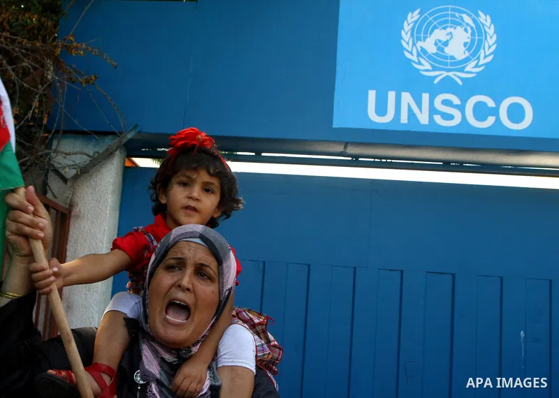 A Palestinian woman chants slogans during a demonstration in support of Palestinian leader Mahmud Abbas' bid for statehood recognition at the United Nations on September 21, 2011 in Gaza City. Palestinians are preparing...