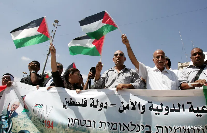 Palestinians protest against US' interference in the Palestinian bid for statehood recognition at the United Nations on September 21, 2011 outside the US General Consulate in east Jerusalem. Palestinians are preparing to...