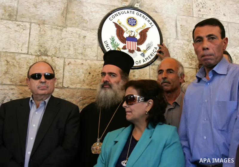 Palestinians protest against US' interference in the Palestinian bid for statehood recognition at the United Nations on September 21, 2011 outside the US General Consulate in east Jerusalem. Palestinians are preparing to...