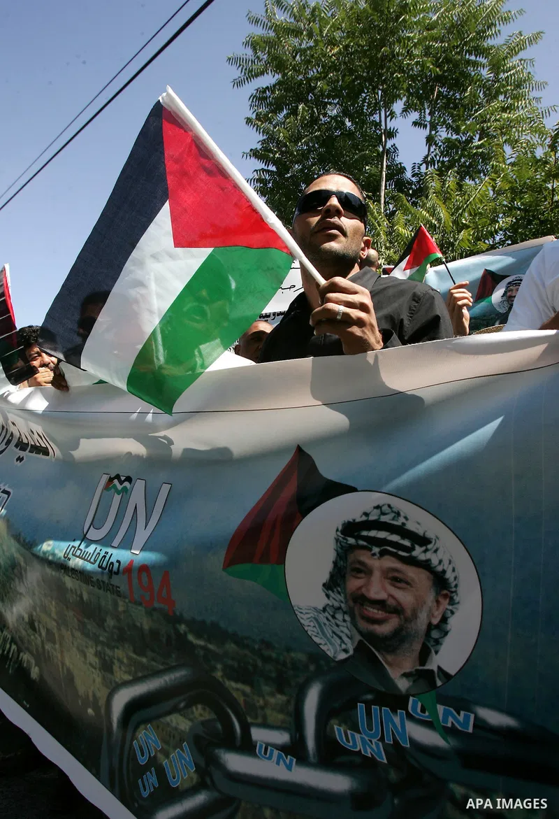 Palestinians protest against US' interference in the Palestinian bid for statehood recognition at the United Nations on September 21, 2011 outside the US General Consulate in east Jerusalem. Palestinians are preparing to...