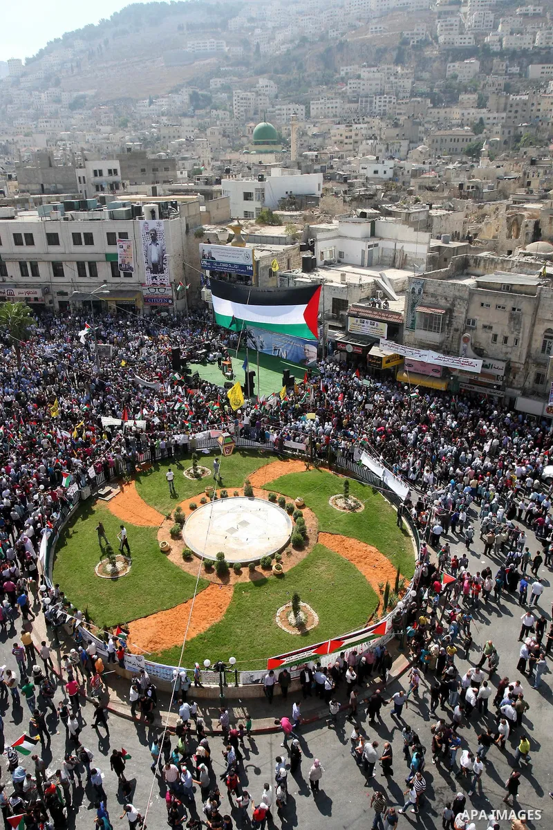 Palestinians rally to express support for the Palestinian bid for statehood recognition at the United Nations on September 21, 2011 in the West Bank city of Nablus. Palestinians are preparing to submit a formal request t...