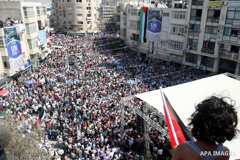 Palestinians participate in a rally in support of the Palestinian bid for statehood recognition in the United Nations, in the West Bank city of Ramallah, Wednesday, Sept. 21, 2011. Thousands of flag-waving Palestinians r...