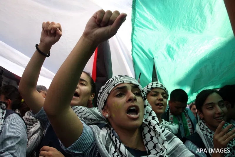 Palestinians participate in a rally in support of the Palestinian bid for statehood recognition in the United Nations, in the West Bank city of Ramallah, Wednesday, Sept. 21, 2011. Thousands of flag-waving Palestinians r...