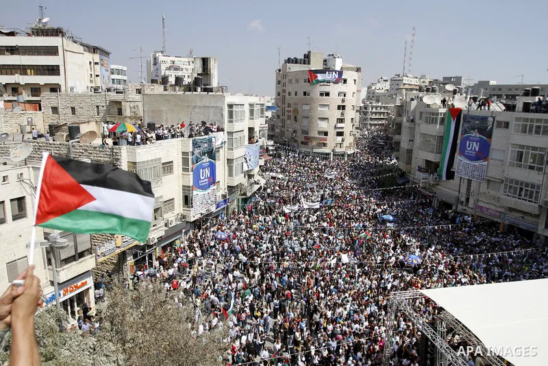 Palestinians participate in a rally in support of the Palestinian bid for statehood recognition in the United Nations, in the West Bank city of Ramallah, Wednesday, Sept. 21, 2011. Thousands of flag-waving Palestinians r...