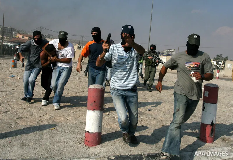 Undercover Israeli police and border police officers arrest Palestinian demonstrators during clashes with the Israeli military at the Qalandia checkpoint between the West Bank city of Ramallah and Jerusalem, Wednesday, S...