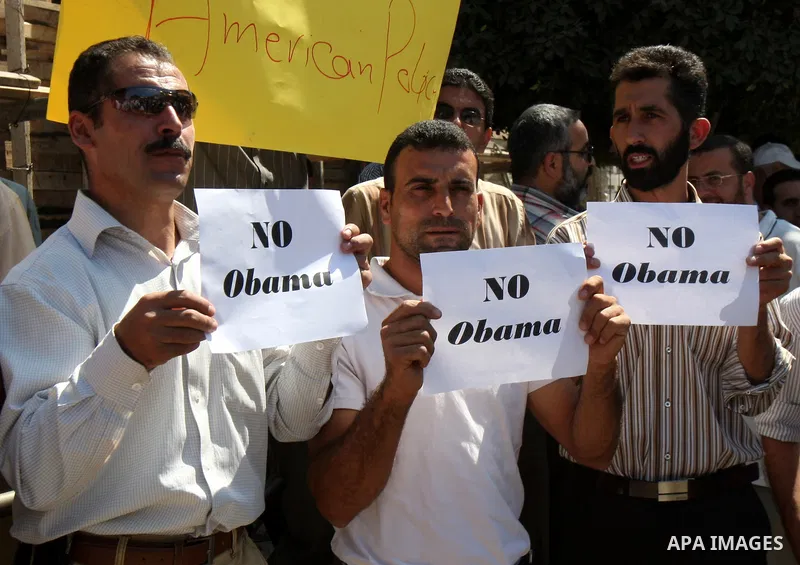 Palestinians hold up signs against US President Barack Obama during a protest in the northern West Bank city of Nablus on September 22, 2011. Palestinians slammed US President Barack Obama's United Nations address a day...