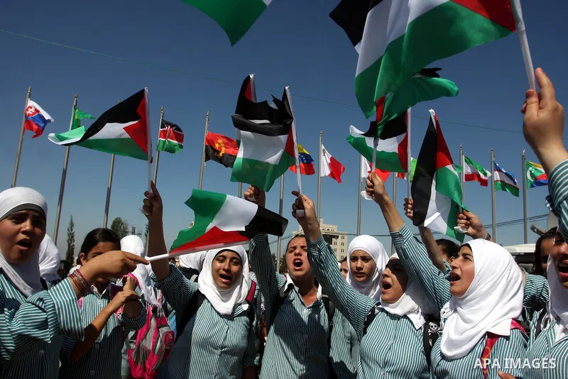 Palestinians school children participate a demonstration in support of the Palestinian bid for statehood recognition in the United Nations in the West Bank city of Ramallah, Thursday, Sept. 22, 2011. Palestinian proteste...
