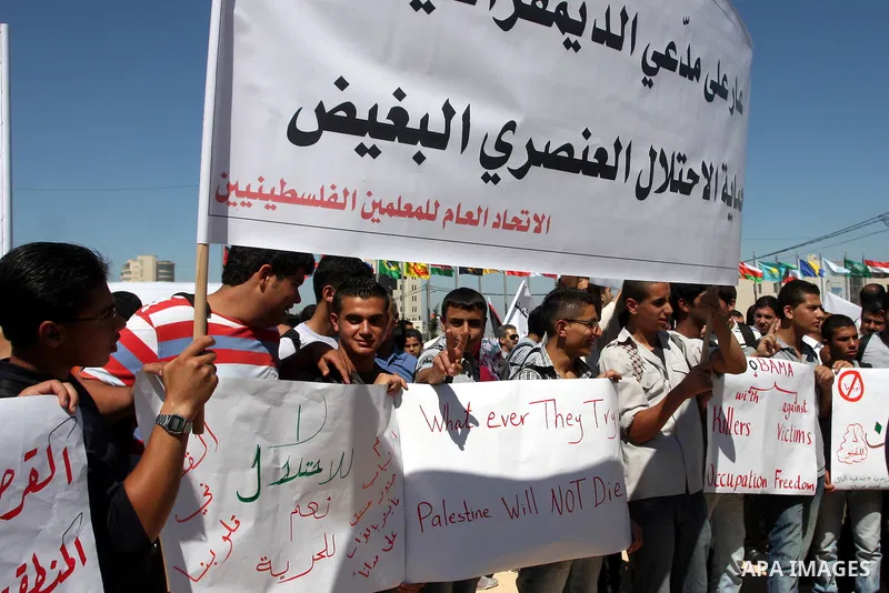 Palestinians school boys participate a demonstration in support of the Palestinian bid for statehood recognition in the United Nations in the West Bank city of Ramallah, Thursday, Sept. 22, 2011. Palestinian protesters h...