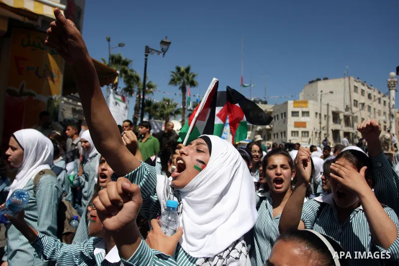 Palestinians school children participate a demonstration in support of the Palestinian bid for statehood recognition in the United Nations in the West Bank city of Ramallah, Thursday, Sept. 22, 2011. Palestinian proteste...