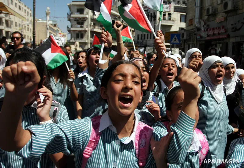 Palestinians school children participate a demonstration in support of the Palestinian bid for statehood recognition in the United Nations in the West Bank city of Ramallah, Thursday, Sept. 22, 2011. Palestinian proteste...