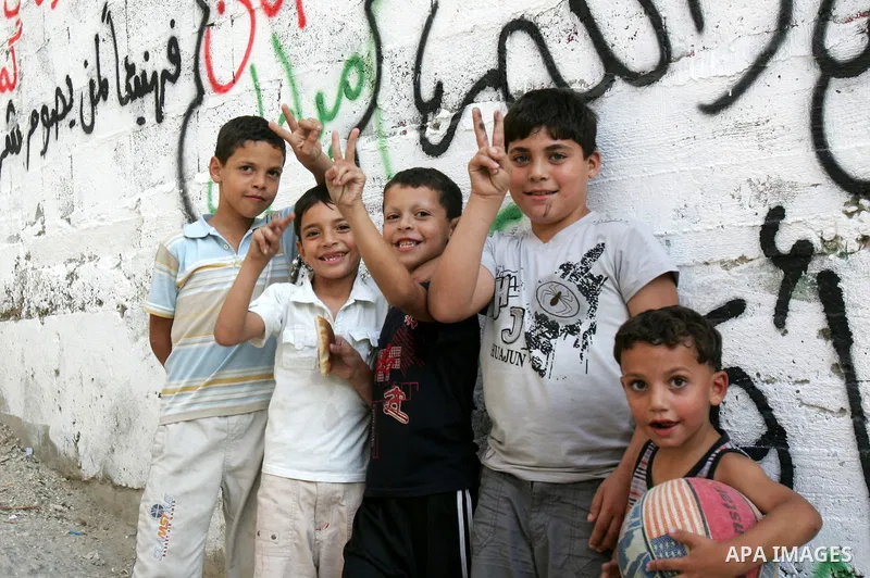 Palestinian children play at a street on September 22, 2011 in the east Jerusalem neighborhood of Silwan. Palestinians are preparing to submit a formal request to become the 194th member of the United Nations when the Ge...