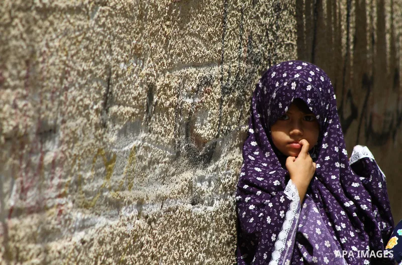 Palestinian girls stand in an alley at the al-Shati refugee camp in Gaza City on September 23, 2011. Photo by Ashraf Amra