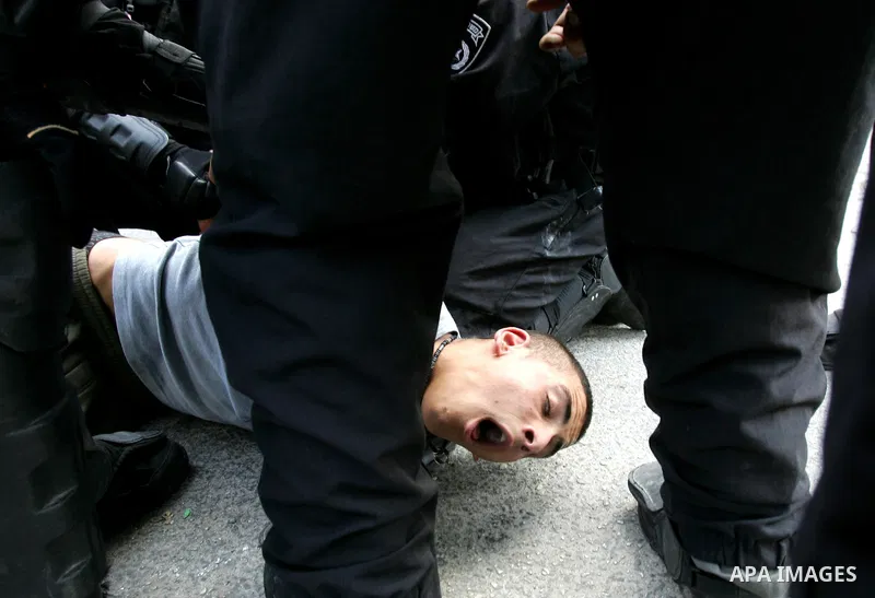 Israeli border police arrest a Palestinian youth for throwing stones at their checkpoint in Ras al-Amud neighborhood of East Jerusalem, Friday Sept. 23, 2011, just hours before their president, Mahmoud Abbas, was to deli...