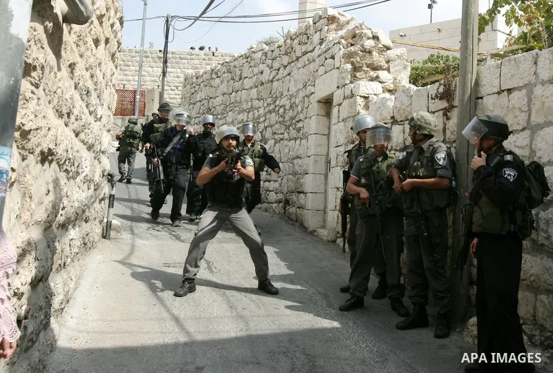 Israeli border police stand guards during clashes with Palestinian stone throwers in the east Jerusalem neighborhood of Ras al-Amud on September 23, 2011, just hours before the president, Mahmoud Abbas, was to deliver hi...