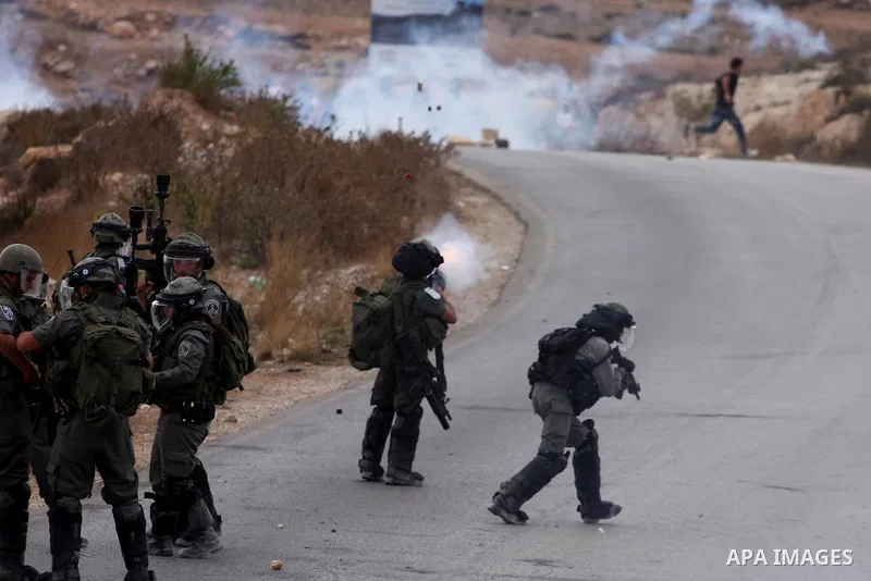 Israeli soldiers fire teargas during a clash with Palestinians in at a weekly protest in the West Bank village of Nabi Saleh, near Ramallah September 23, 2011. Israeli security forces were on high alert after Friday pray...