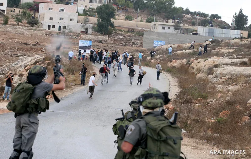 Israeli soldiers fire teargas during a clash with Palestinians in at a weekly protest in the West Bank village of Nabi Saleh, near Ramallah September 23, 2011. Israeli security forces were on high alert after Friday pray...