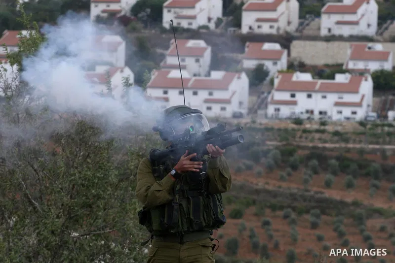 Israeli soldiers fire teargas during a clash with Palestinians in at a weekly protest in the West Bank village of Nabi Saleh, near Ramallah September 23, 2011. Israeli security forces were on high alert after Friday pray...