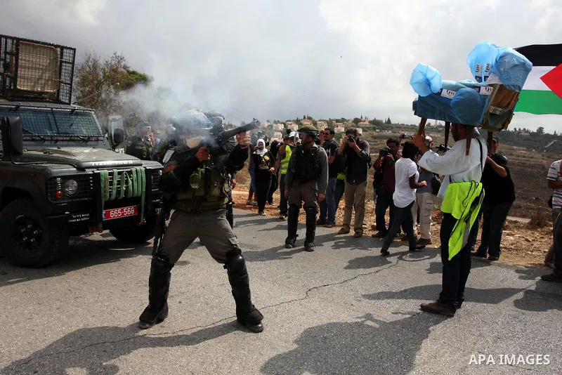 Israeli soldiers fire teargas during a clash with Palestinians in at a weekly protest in the West Bank village of Nabi Saleh, near Ramallah September 23, 2011. Israeli security forces were on high alert after Friday pray...