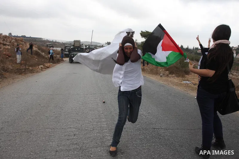 Israeli soldiers fire teargas during a clash with Palestinians in at a weekly protest in the West Bank village of Nabi Saleh, near Ramallah September 23, 2011. Israeli security forces were on high alert after Friday pray...