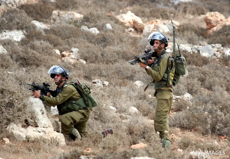 Israeli troops clash with Palestinian stone throwers in the West Bank village of Qusra, south of Nablus, on September 23, 2011. A Palestinian man was shot dead by Israeli troops in clashes which erupted after settlers at...