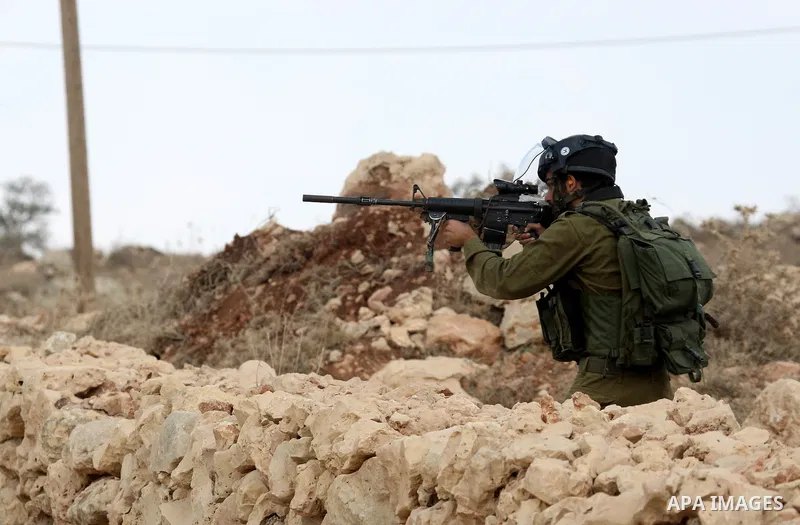 Israeli troops clash with Palestinian stone throwers in the West Bank village of Qusra, south of Nablus, on September 23, 2011. A Palestinian man was shot dead by Israeli troops in clashes which erupted after settlers at...