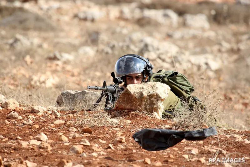 Israeli troops clash with Palestinian stone throwers in the West Bank village of Qusra, south of Nablus, on September 23, 2011. A Palestinian man was shot dead by Israeli troops in clashes which erupted after settlers at...