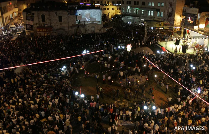 Palestinians attend a public screening of Palestinian President Mahmoud Abbas' speech at the United Nations, in the West Bank city of Nablus September 23, 2011. Abbas asked the United Nations on Friday to recognize a sta...