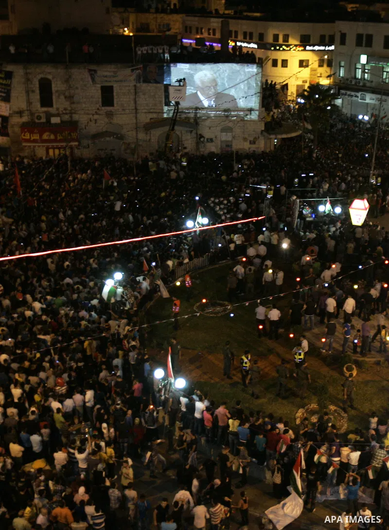 Palestinians attend a public screening of Palestinian President Mahmoud Abbas' speech at the United Nations, in the West Bank city of Nablus September 23, 2011. Abbas asked the United Nations on Friday to recognize a sta...
