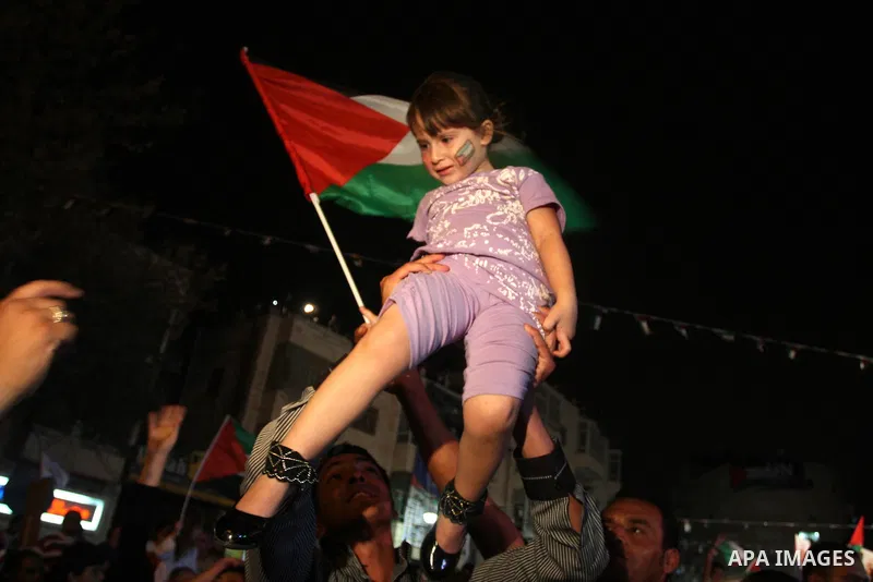 Palestinians attend a public screening of Palestinian President Mahmoud Abbas' speech at the United Nations, in the West Bank city of Ramallah September 23, 2011. Abbas asked the United Nations on Friday to recognize a s...