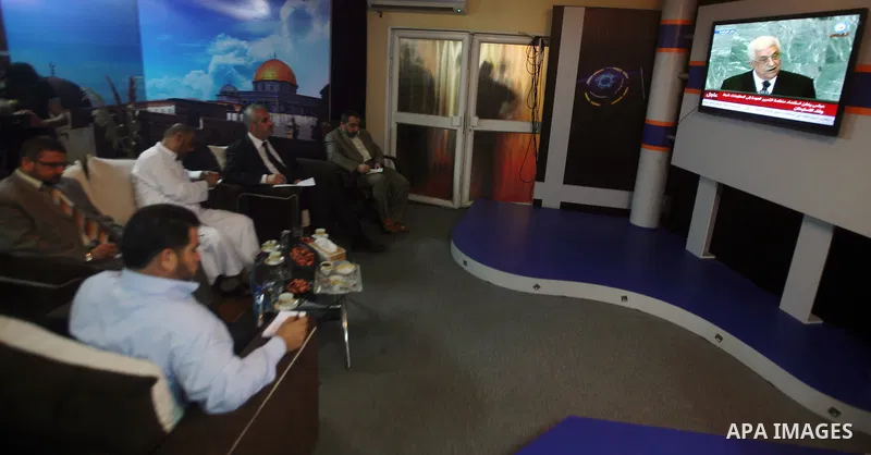 Palestinian Hamas spokesmen watch a television broadcast of Palestinian President Mahmoud Abbas speaking at the United Nations in New York, in Gaza City, on 23 September 2011. Palestinian President Mahmoud Abbas on the s...
