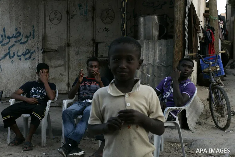 Palestinian children sit outside their houses in Rafah refugee camp, southern Gaza Strip on Sep. 24, 2011. Palestinian Authority President Mahmoud Abbas, hands over a formal letter to be admitted as a state to the UN Sec...