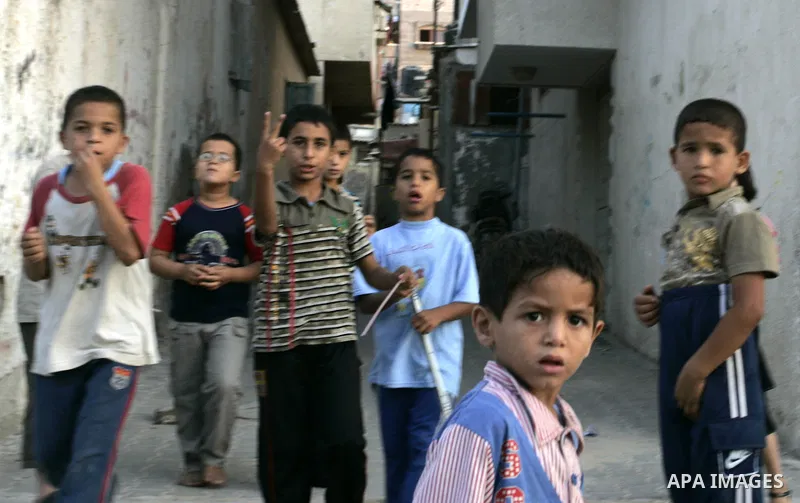 Palestinian children play outside their houses in Rafah refugee camp, southern Gaza Strip on Sep. 24, 2011. Palestinian Authority President Mahmoud Abbas, hands over a formal letter to be admitted as a state to the UN Se...