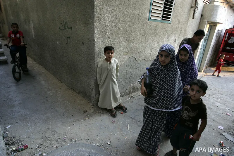 Palestinian children stand outside their houses in Rafah refugee camp, southern Gaza Strip on Sep. 24, 2011. Palestinian Authority President Mahmoud Abbas, hands over a formal letter to be admitted as a state to the UN S...