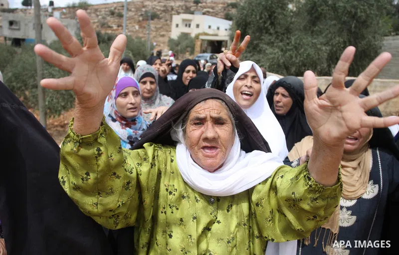 Palestinian women mourn during the funeral of Issam Badran in the West Bank village of Qusra near Nablus, Saturday, Sept. 24, 2011. Badran was shot dead Friday during a clash with Israeli soldiers and settlers. The shoot...