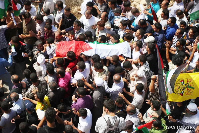 Palestinians carry the body of Essam Kamal during his funeral in the West Bank village of Qusra near Nablus September 24, 2011. Israeli security forces shot dead Kamal in the West Bank on Friday during a confrontation in...