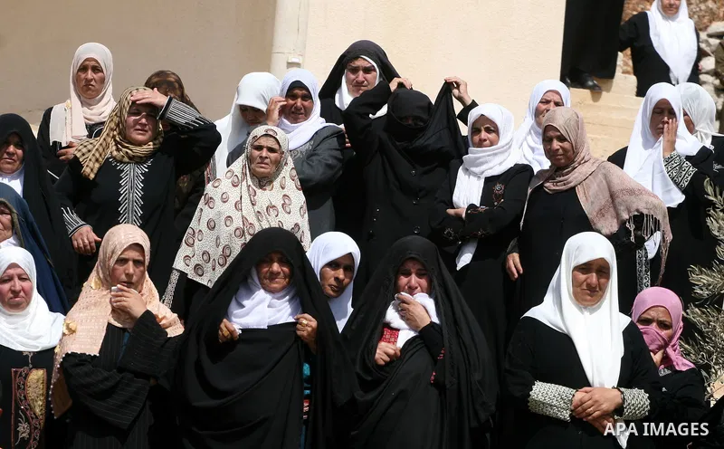 Palestinian women mourn during the funeral of Issam Badran in the West Bank village of Qusra near Nablus, on Sept. 24, 2011. Badran was shot dead Friday during a clash with Israeli soldiers and settlers. The shooting cam...