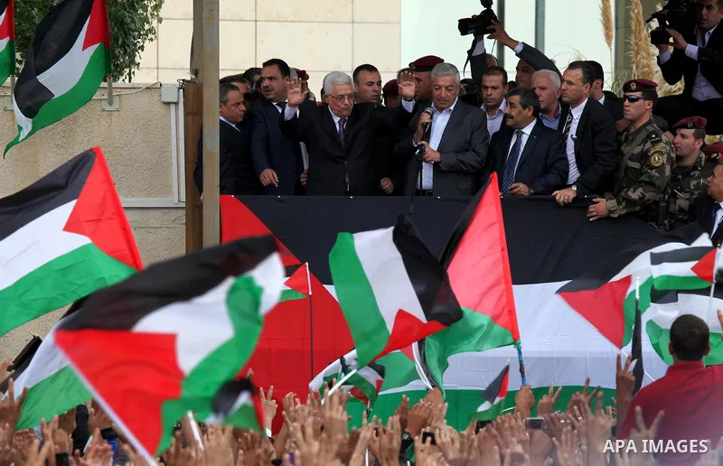 Palestinian President Mahmoud Abbas (Abo Mazen) addresses the crowd during a celebration in the West Bank city of Ramallah upon his return from the U.N. General Assembly in the U.S., on Sept. 25, 2011. Palestinians want...