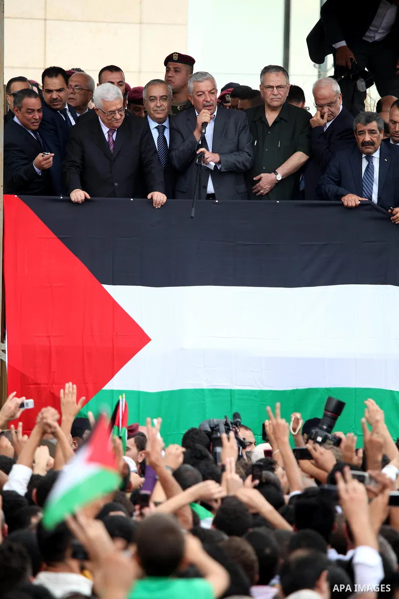 Palestinian President Mahmoud Abbas (Abo Mazen) addresses the crowd during a celebration in the West Bank city of Ramallah upon his return from the U.N. General Assembly in the U.S., on Sept. 25, 2011. Palestinians want...