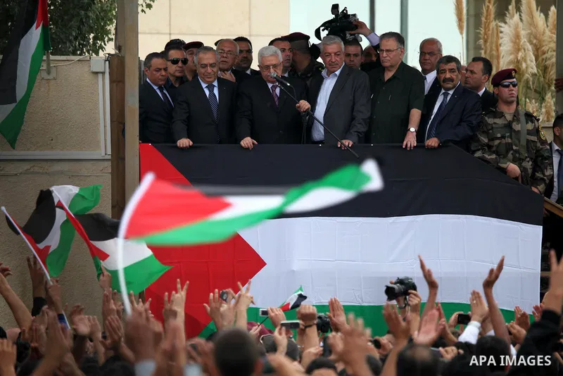 Palestinian President Mahmoud Abbas (Abo Mazen) addresses the crowd during a celebration in the West Bank city of Ramallah upon his return from the U.N. General Assembly in the U.S., on Sept. 25, 2011. Palestinians want...