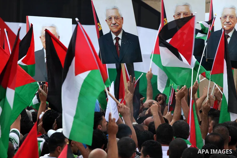 Thousands of cheering Palestinians welcome their president Mahmud Abbas outside his Ramallah headquarters on Sept. 25, 2011, as he returned from delivering a historic UN membership bid. Photo by Issam Rimawi