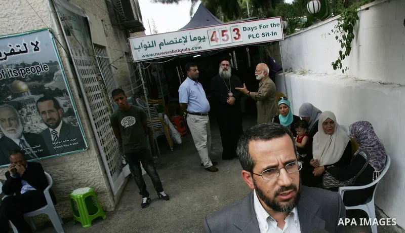 Member of Palestinians Hamas legislators, Khaled Abu Arafa stands at the Red Cross compound in east Jerusalem on September 26, 2011, after the member of Hamas legislative council, Ahmad Atun was arrested in an operation...