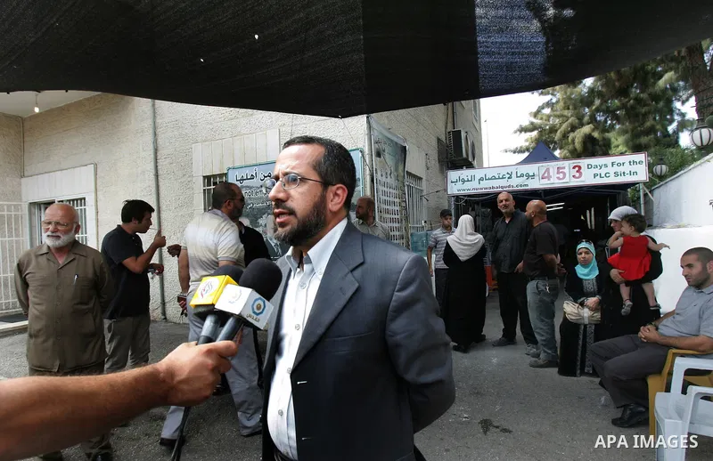 Member of Palestinians Hamas legislators, Khaled Abu Arafa delivers speech at the Red Cross compound in east Jerusalem on September 26, 2011, after the member of Hamas legislative council, Ahmad Atun was arrested in an o...