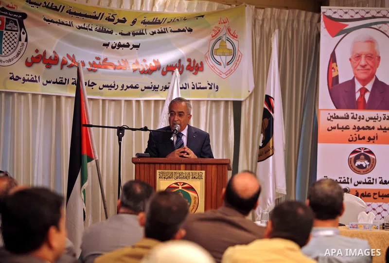 Palestinian Prime Minister, Salam Fayyad delivers speech during the opening of the social responsibility of the Palestinian universities conference, where organized by Al-Quds Open University in the West Bank city of Nab...
