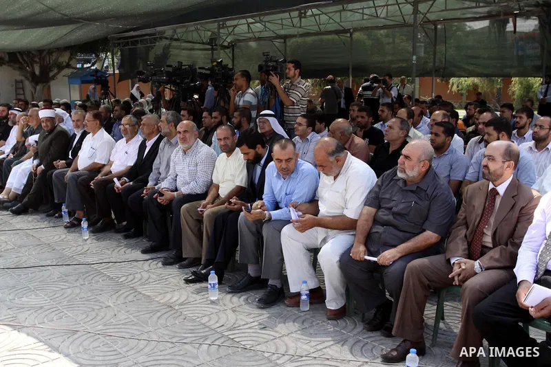 Palestinians take part in a protest against arrested the member of Hamas legislative council, Ahmad Atun in an operation by undercover police officers in Gaza city on Sep. 27, 2011. Atun is one of three senior Hamas MPs...