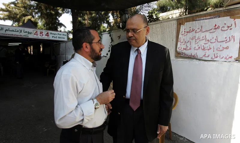 Members of Palestinians Hamas legislators, take part in a protest at the Red Cross compound in east Jerusalem on September 27, 2011, after the member of Hamas legislative council, Ahmad Atun was arrested in an operation...