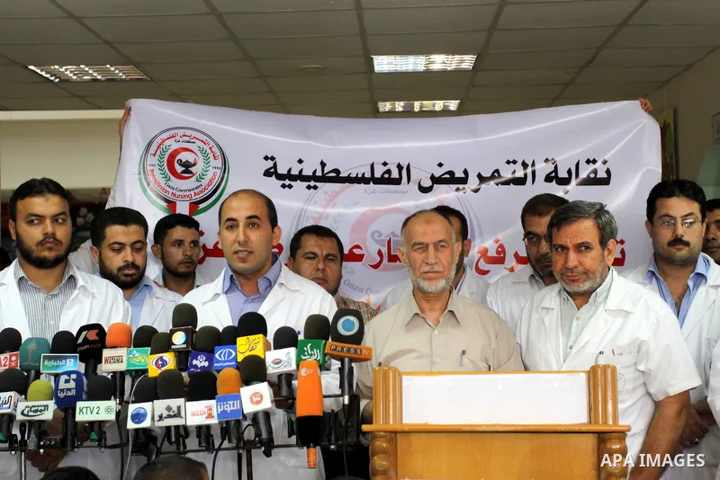 Palestinian doctors of Syndicate of Medical Professions deliver speech in a press conference at Abdel Aziz al-Rantisi hospital in Gaza city on Sep. 28, 2011. This protest organised against the lack of medicine.. Photo by...